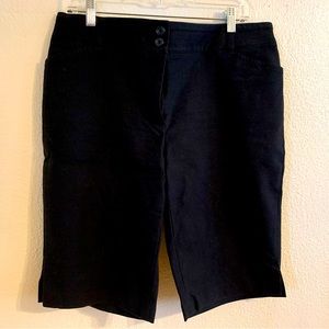 Black sleek knee length shorts. Stretchy and comfy smart casual.